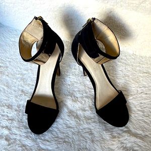 Also, size 7, black heels with Gold accessories.